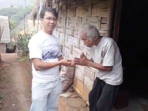 Grandpa receiving his monthly food allowance