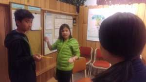 Victor and NK go over assignments for event day