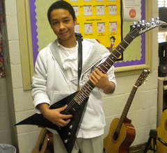LKR student with the new guitar he won.