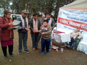 participant receiving certificate and medal