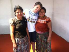 floor-laying volunteer with family