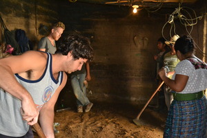 volunteers help with a floor pour