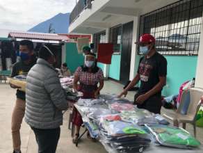 GHA distributing clothing in San Marcos