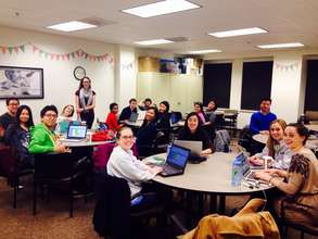 Hardworking CLS Leadership team reading apps!