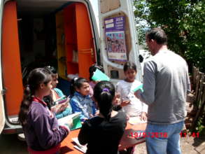 Girls eagerly select their books