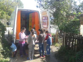 Young women in the village choose their books