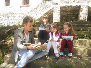 Librarian reads to children