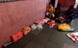 Children at shelter homes receiving the groceries