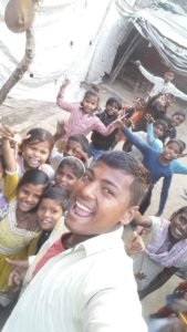 Rahul with children from his native village