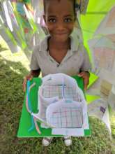 Student displays his artwork for the festival