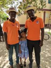 Teachers Raphael & Vladiny with a student