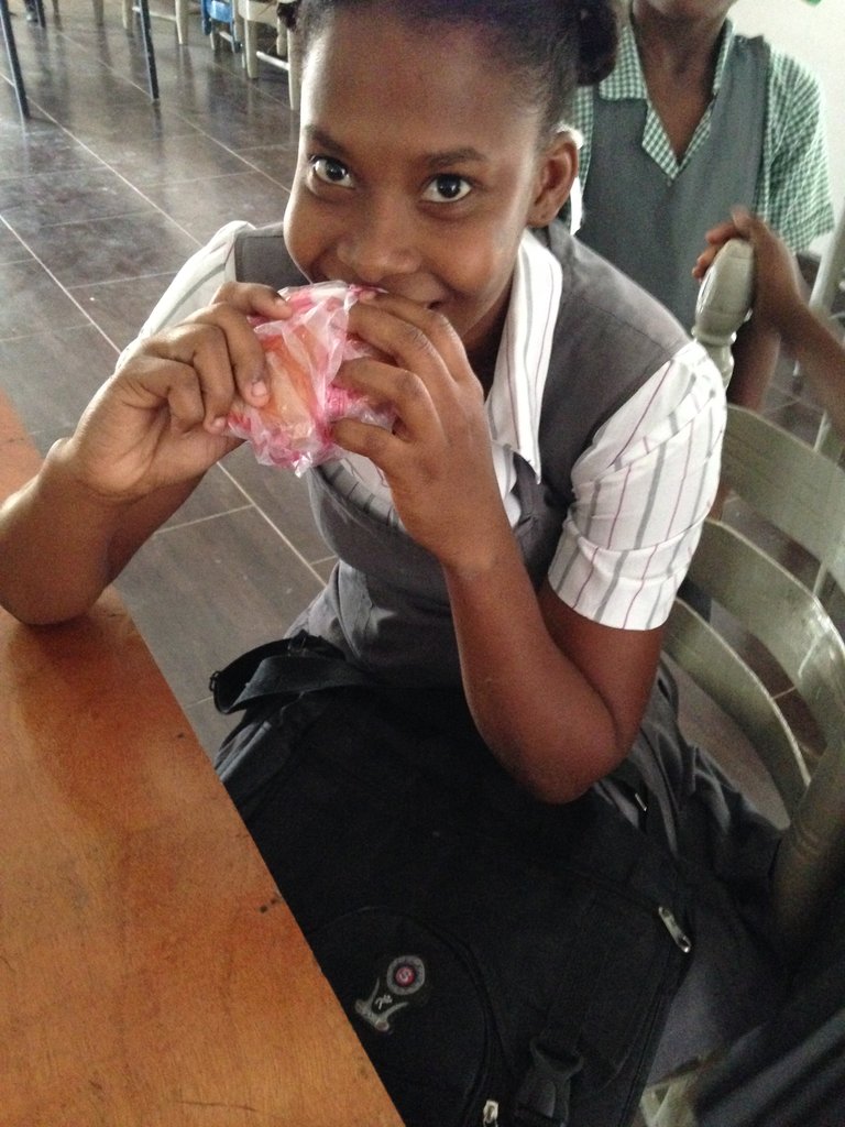 A student enjoying a peanut butter sandwich