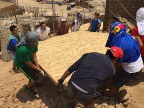 Our volunteers lifting one of the heavy floors!!