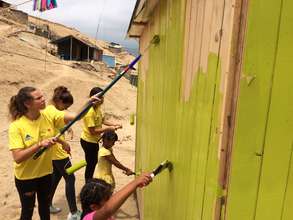 Our volunteers painting one of the new houses!!