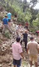 volunteers helping with washed out road