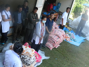 Rajbash Hospital staff distributing supplies
