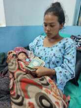 Birth mother with cash and Baby