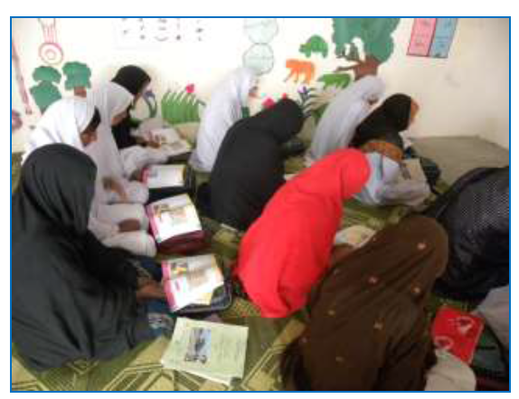 Girls in literacy class in one of the new villages
