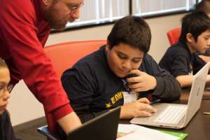 A Googler teaches a student in an apprenticeship