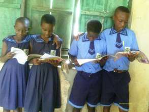 Kids reading books we donated