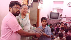 Orphan Children receiving winter blanket in JoyHom