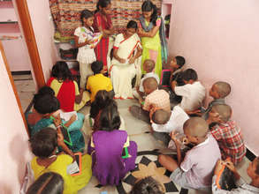 teacher giving classes to orphan children