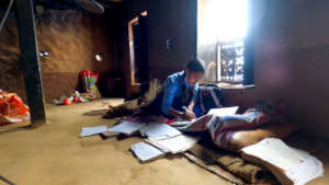 An SGT student studying in her home in Kavre,Nepal