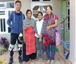 Dr. Aruna Uprety (right) with Sunita & her family