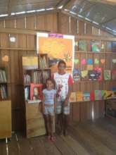 Children enjoying the library of their community