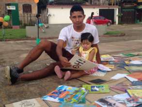 Dad reading to his daughter