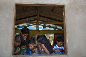 Children reading at the library