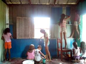 Children painting inside the library