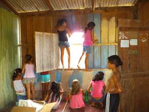 Children painting inside the library