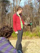 Mentor, Adam, sharing barred owl with students