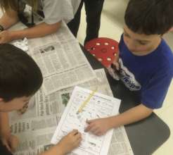 Jeffrey and Quincy identify a bone from a pellet
