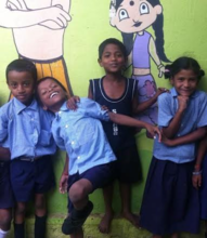 The kids showing their classroom wall