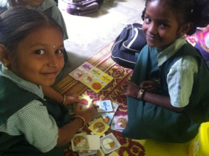 Children learning in their stations