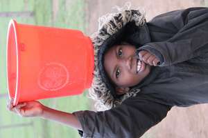 carrying water  early in the morning before school