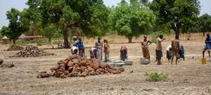 Villages working at rainwater catchment basin