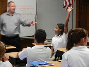 JA volunteer Rob Fregault teaches 8th graders