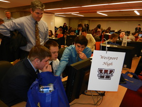 Volunteer Neal Gouck & his team discuss strategy.