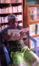 Child reads Fatou Keita in FAVL library