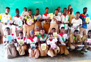 Middle school students with books