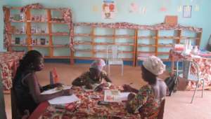 FAVL-BF staff and librarian and young reader