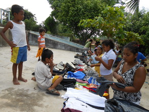 Women and children choosing clothes