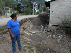 A woman observing the flood damages