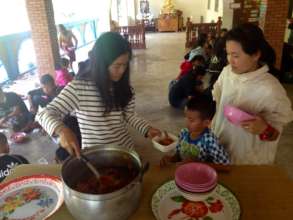 Serving Lunch to the children at HDS