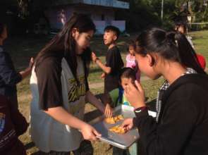Korean volunteer serves  dessert