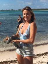 Pro surfer Alana Blanchard before releasing turtle