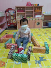 Her favorite thing - to play with blocks at school
